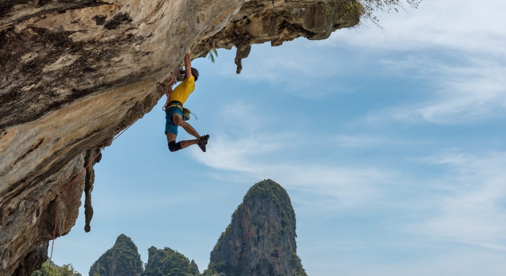 person doing rock climbing